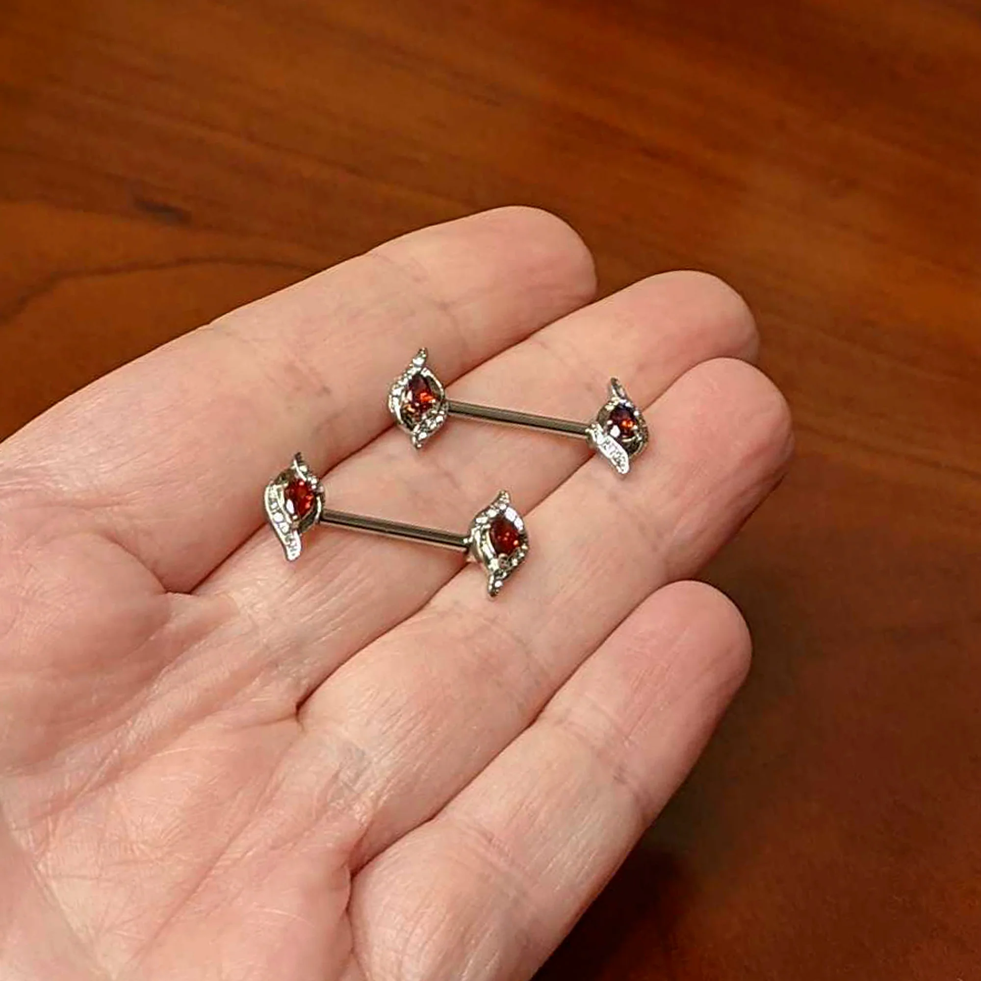 14G 9/16 Clear Red Gem Swirling Oval Barbell Nipple Ring Set - Image 4
