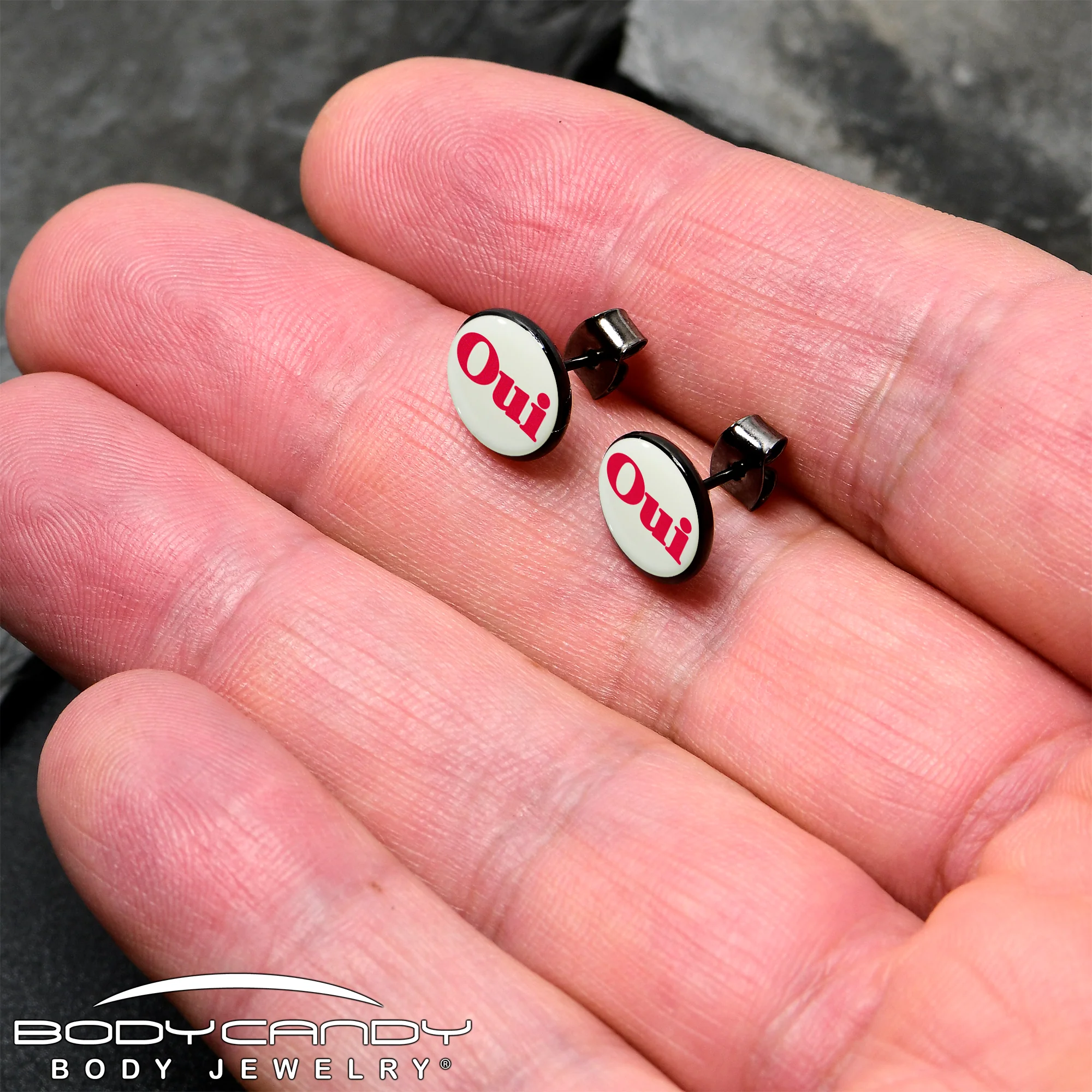 Black Anodized OUI Glow in the Dark Stud Earrings by Onyx O - Image 2